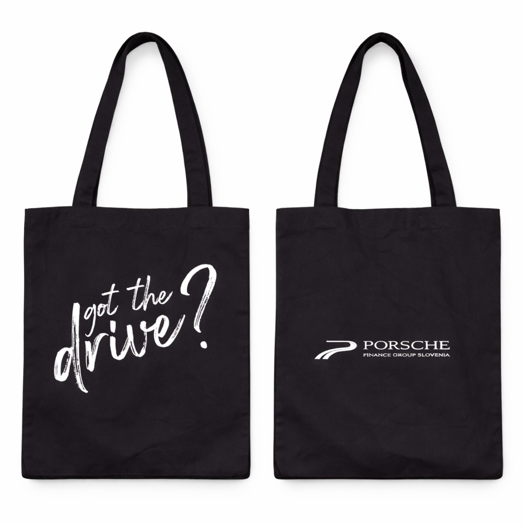 Black tote bag with 'got the drive?' text and Porsche logo on a white background
